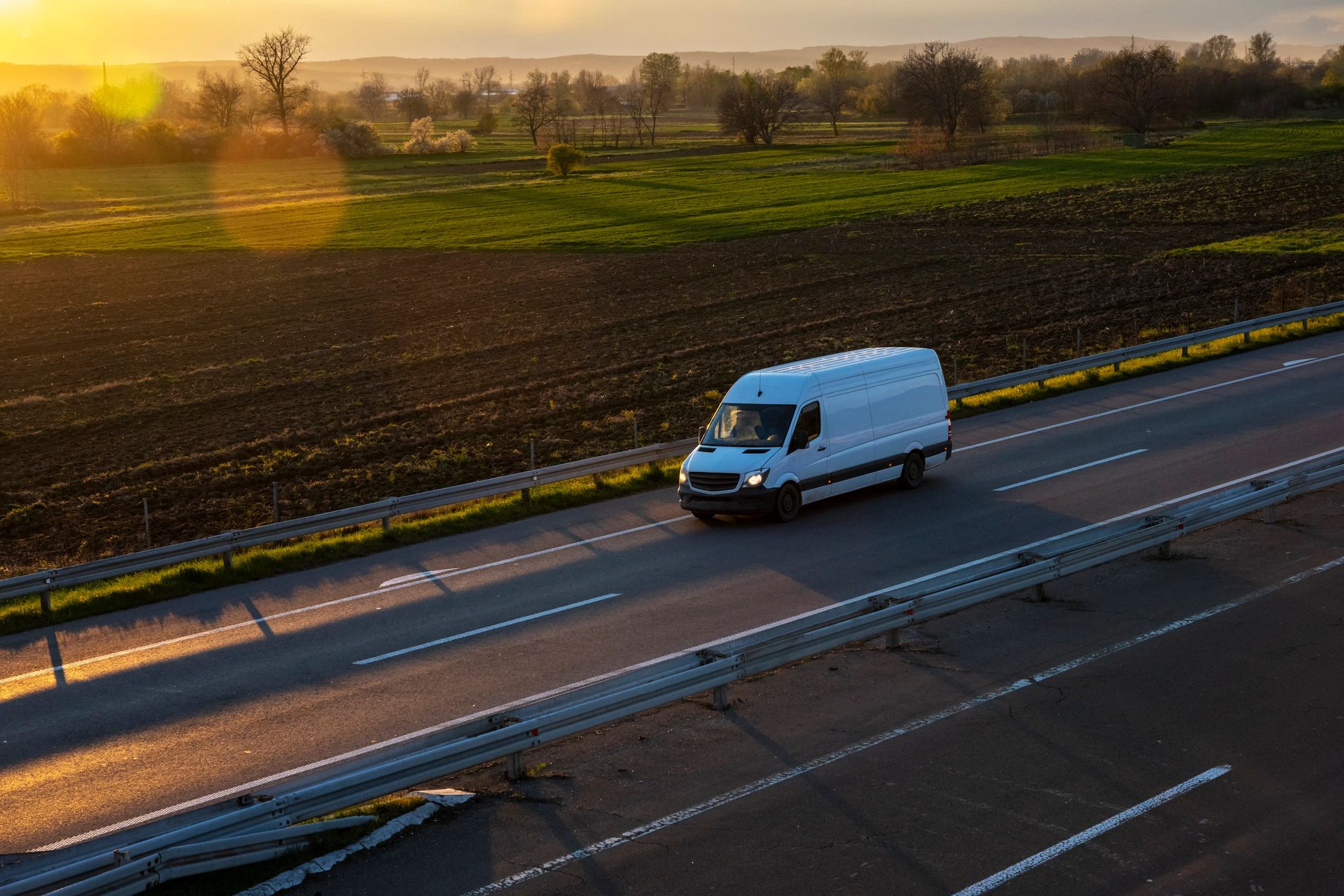 Trusty Courier Logistics delivery van on open road